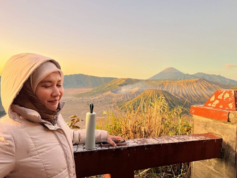 A guest watching the golden sunrise over the Bromo caldera