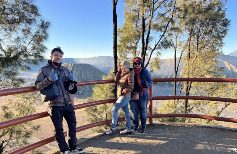 Guests at a railing viewpoint over the Tengger caldera