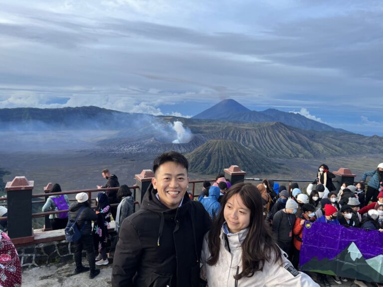 Guests at the Bromo sunrise viewpoint with the volcanoes behind