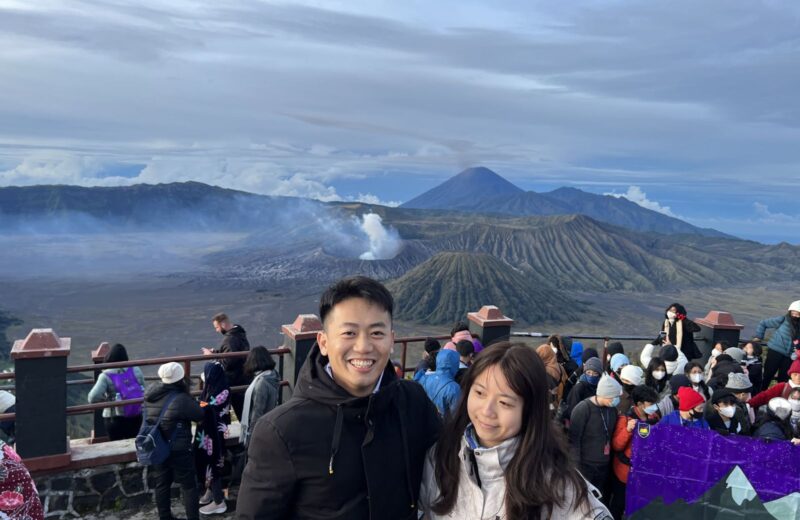 Guests at the Bromo sunrise viewpoint with the volcanoes behind