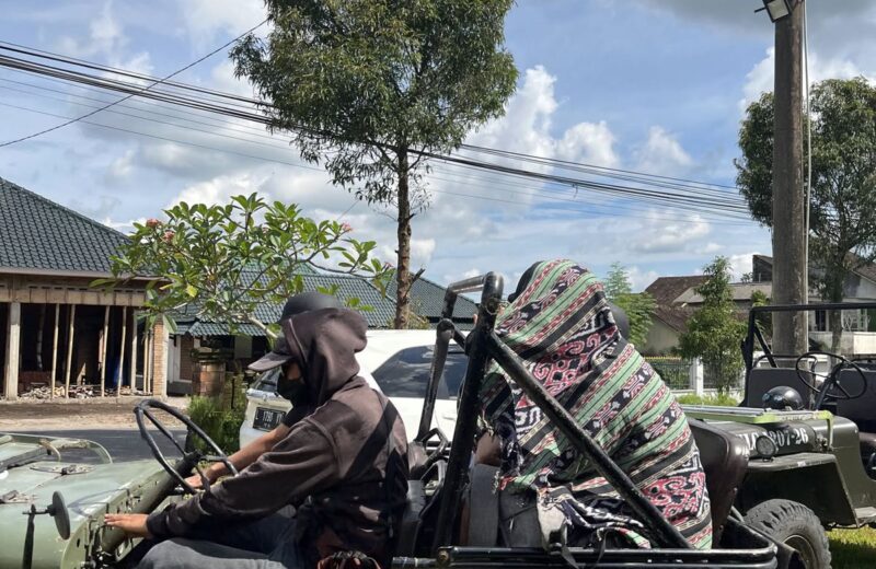 Olive-green open jeep before a Merapi jeep tour
