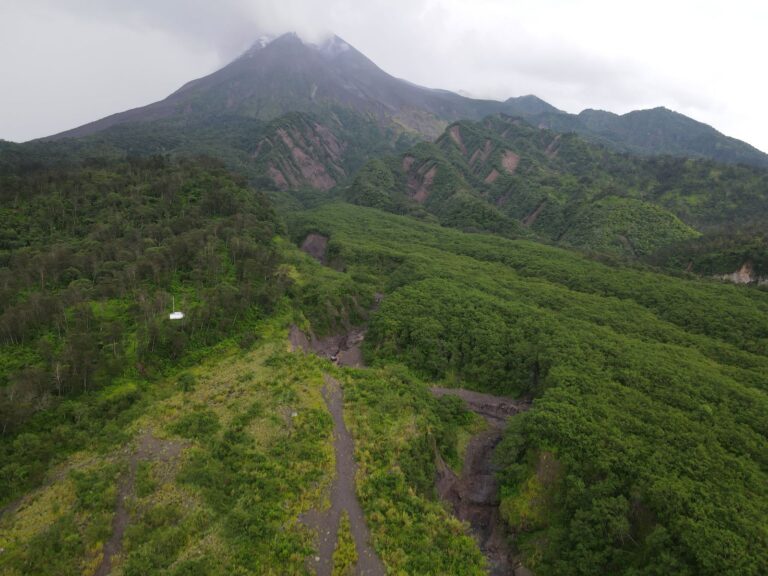 Mount Merapi and the green valley of old lava flows